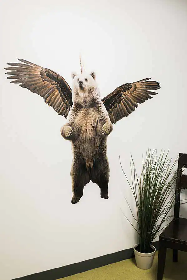 A large wall decal of the Name.com mascot, the Bearglecorn