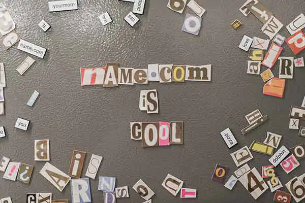 A series of fridge magnets that spells out Name.com is cool